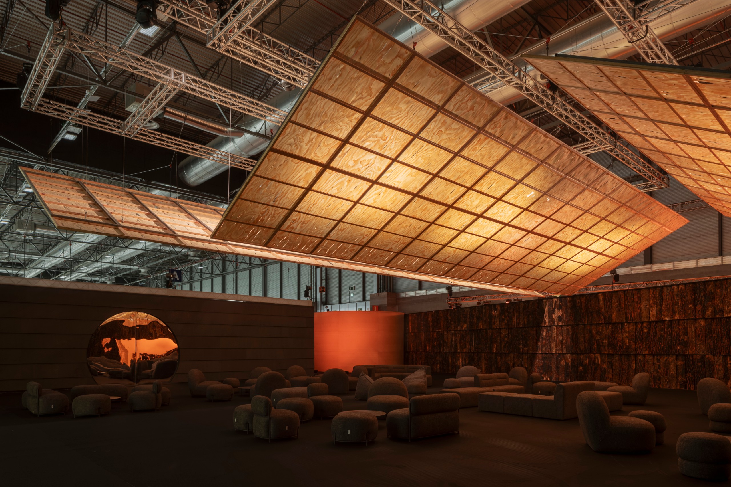 Glowing timber planes tilting at different angles across the fair hall