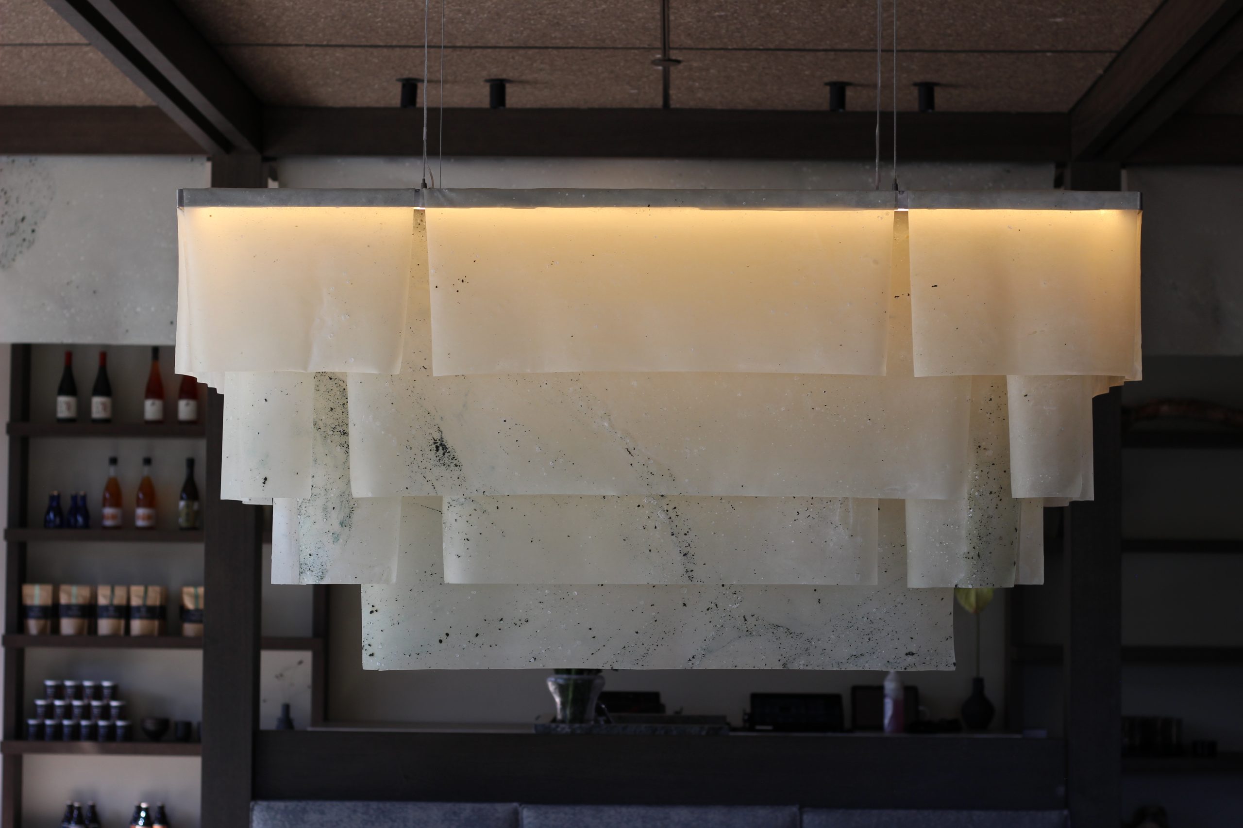Semi-translucent seaweed and algae bio-textile panels inside Sticks’n’Sushi in Lyngby