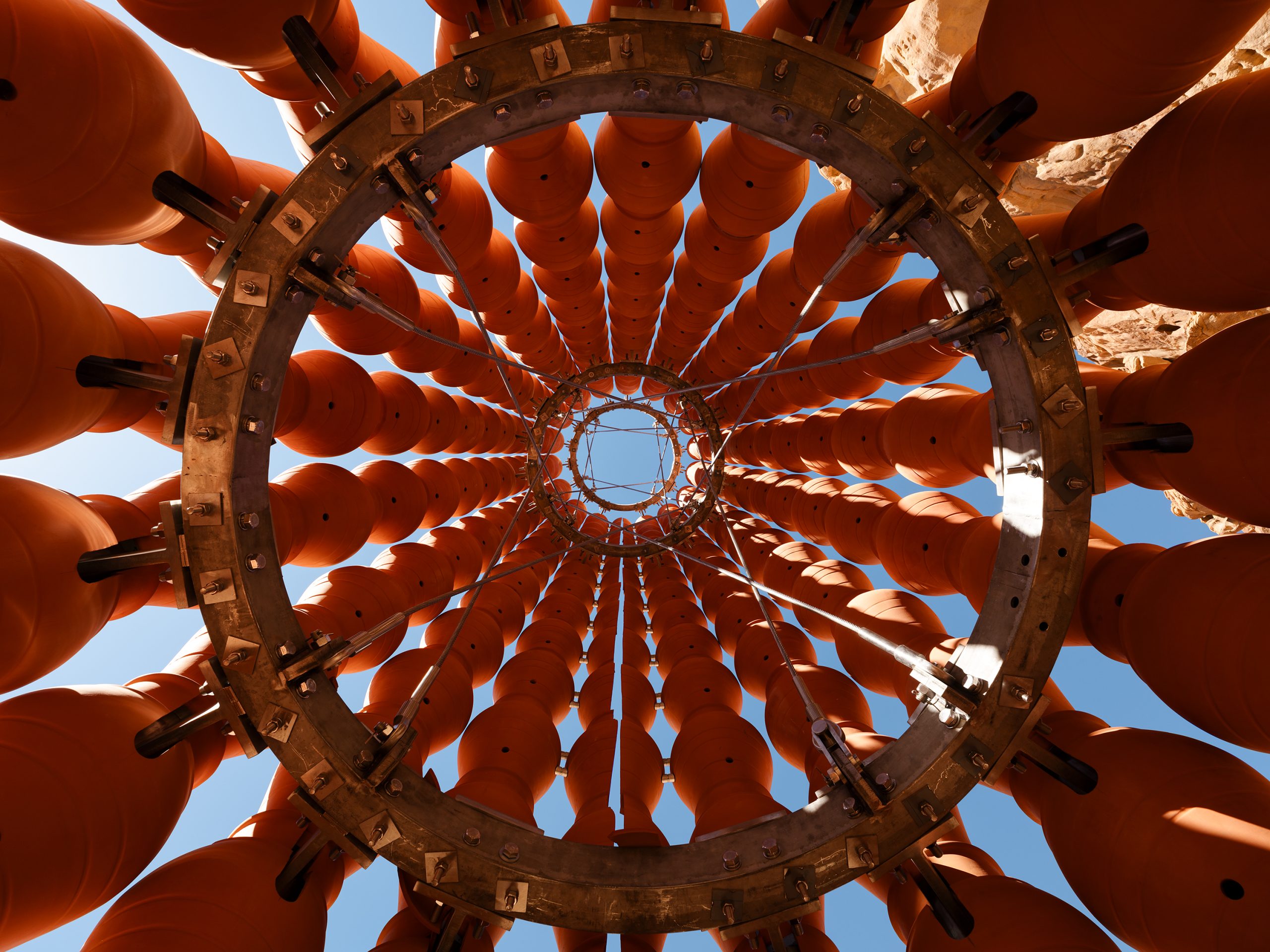 The installation’s vessels appear poised between human making and their eventual return to soil.