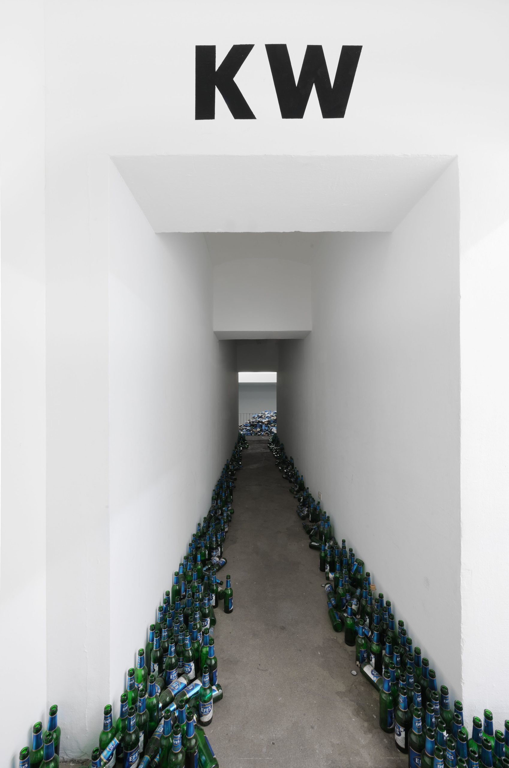 Glass and cardboard remains of the beer bottle pyramid