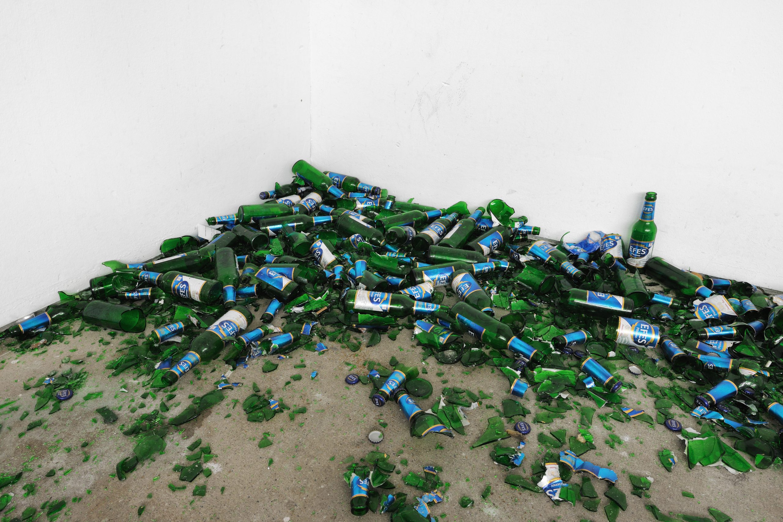 Corner view of glass and cardboard remains from the installation