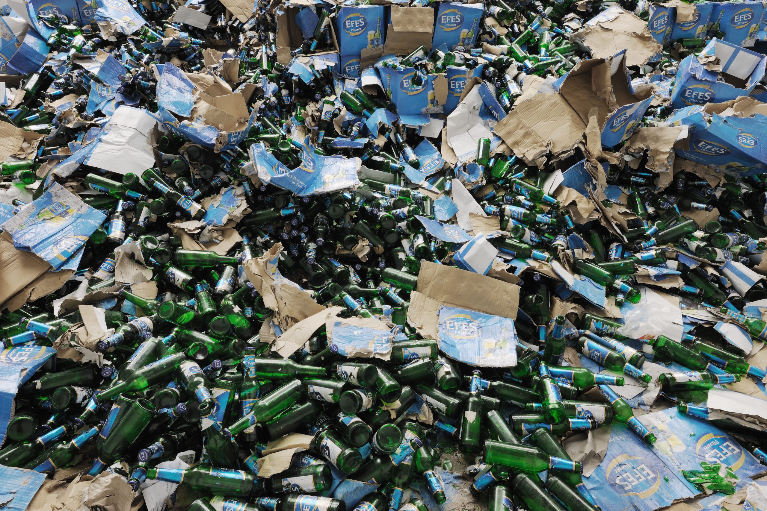 Close view of Efes beer bottles and cardboard cases in the installation