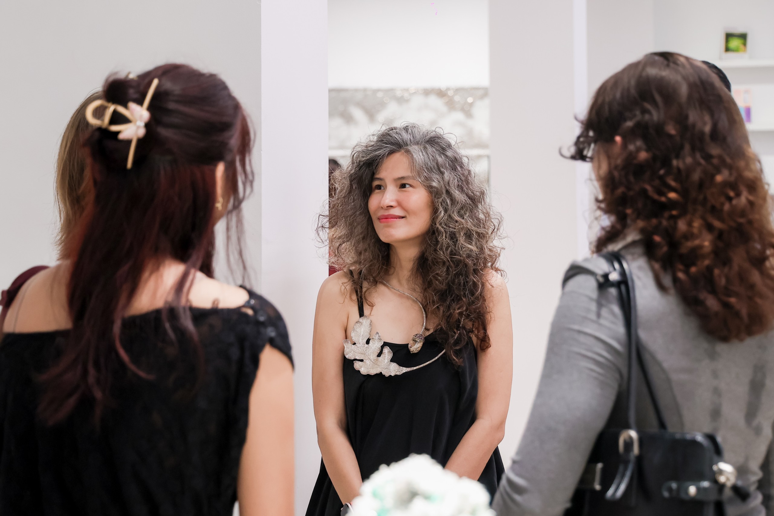 Guests talking at the exhibition opening