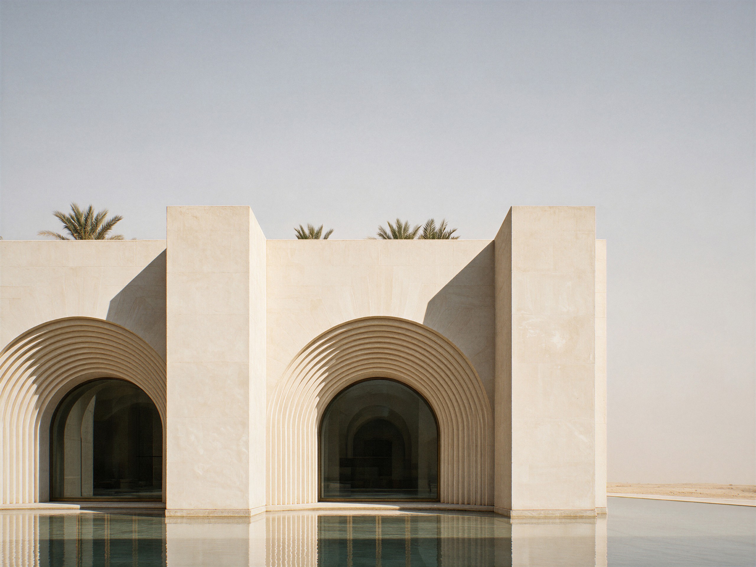 Museum of Contemporary Art Riyadh by Balzar Architects, the façade over the reflecting pool, with the palm grove