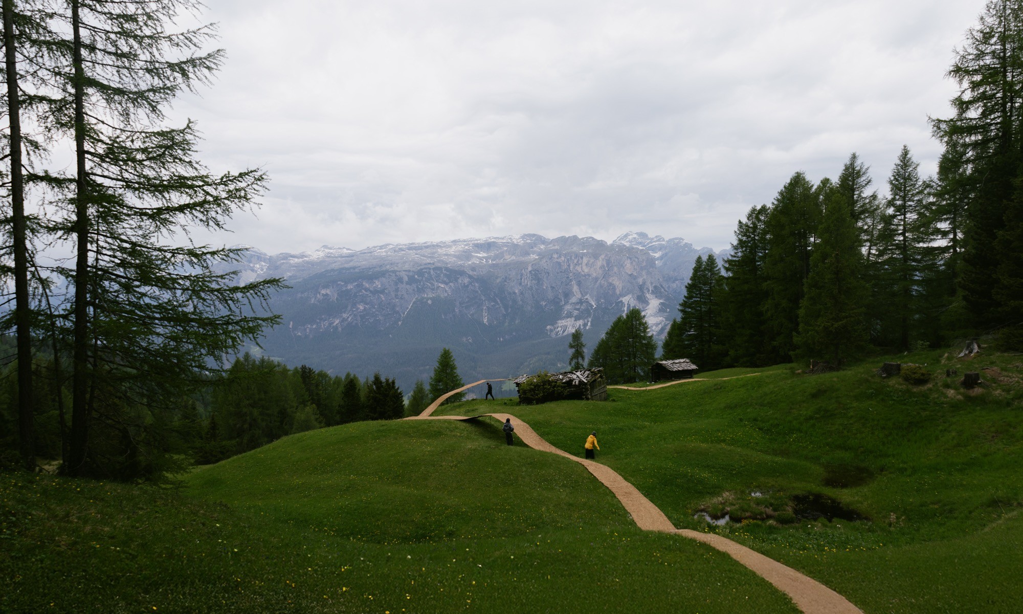 Trace of Land by ELSE, a meandering hay canopy across the Armentara meadows in Val Badia