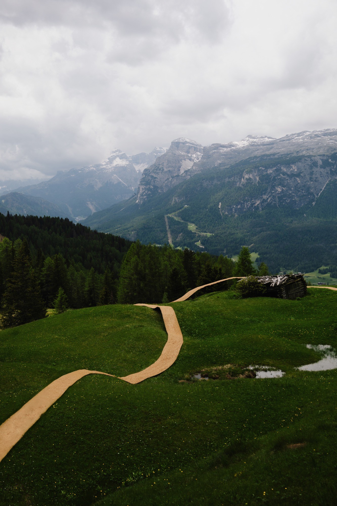 Trace of Land by ELSE, a meandering hay canopy across the Armentara meadows in Val Badia