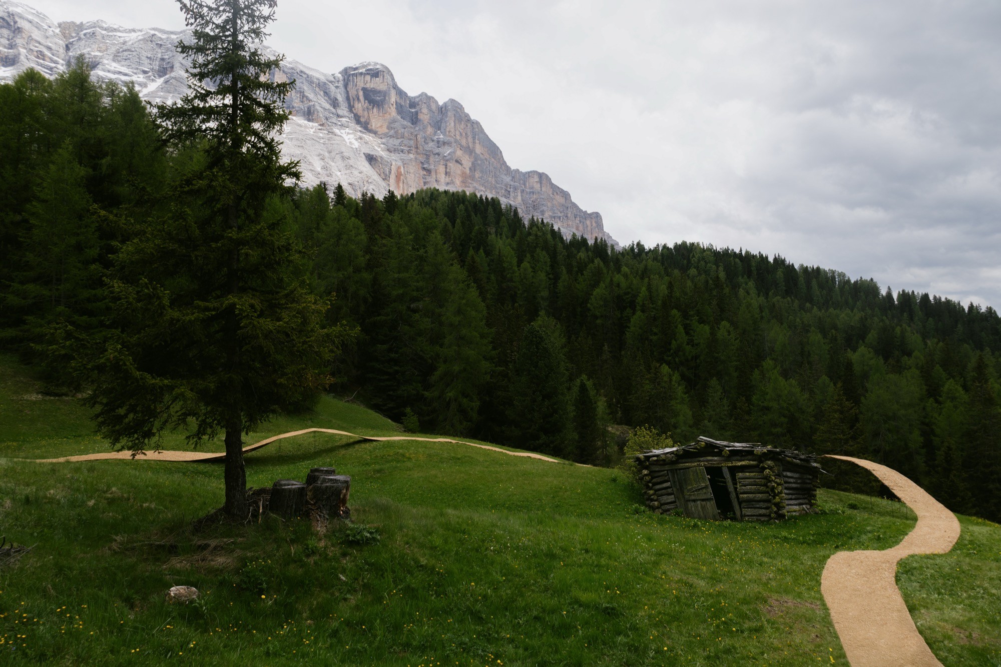 Trace of Land by ELSE, a meandering hay canopy across the Armentara meadows in Val Badia