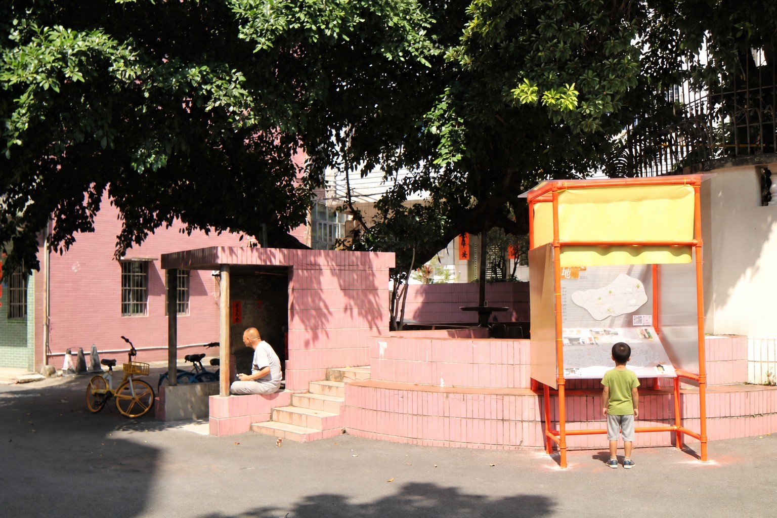 Children stop to read the panels