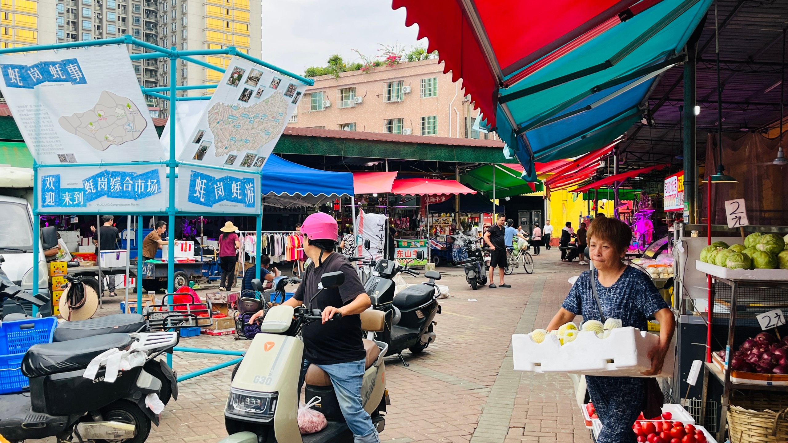 Villagers passing through the market stop to look