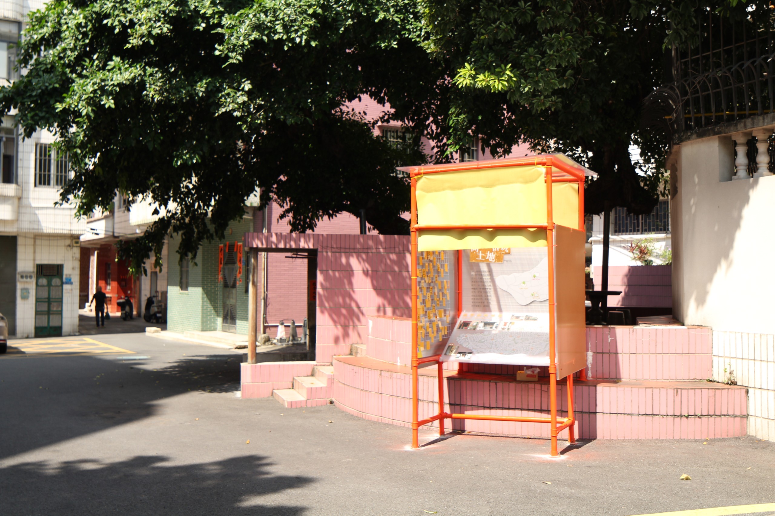 Haogang Ji: the orange installation beneath the banyan tree beside the Earth God Temple