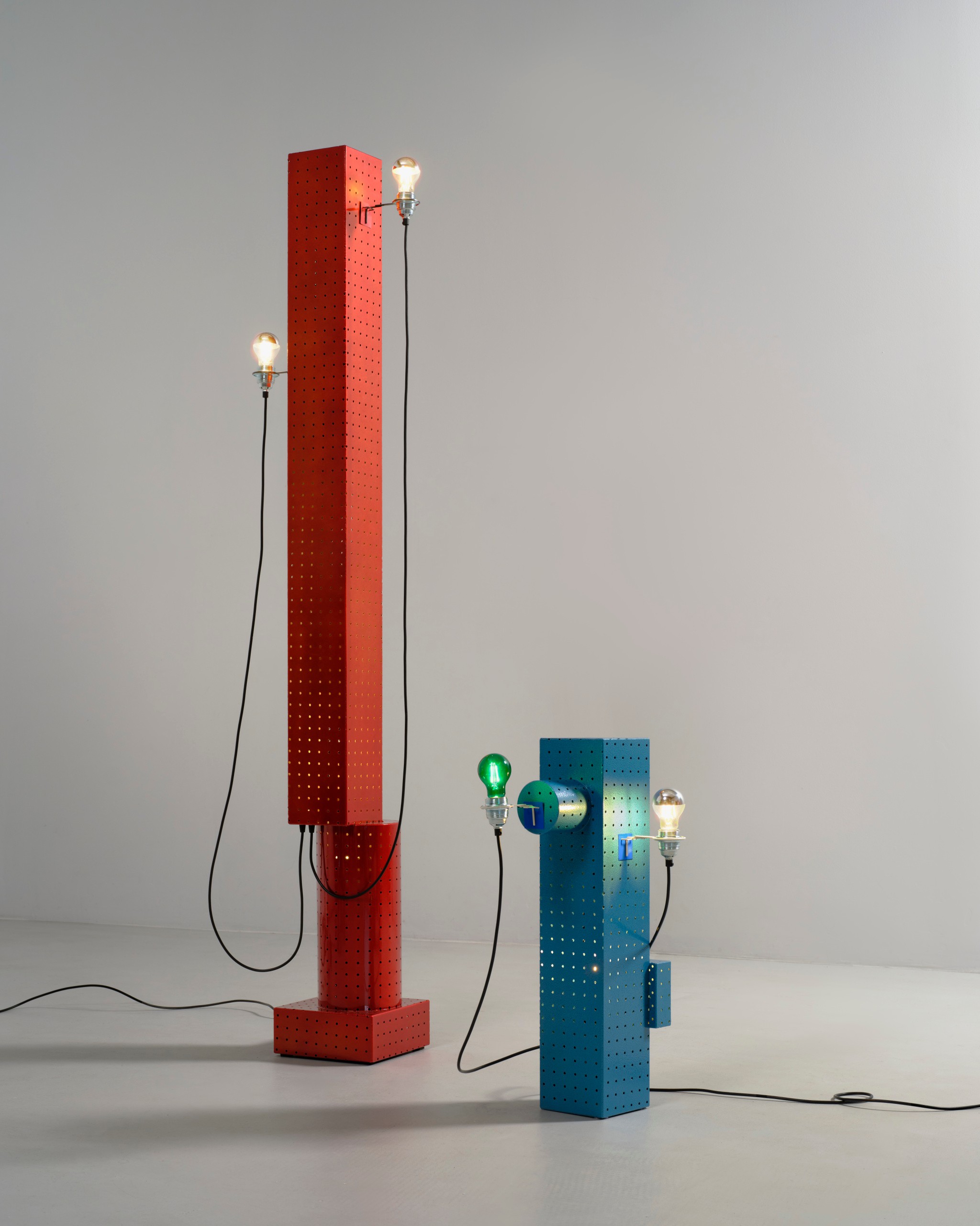Red pegboard floor lamp and blue table lamp by Job van den Berg