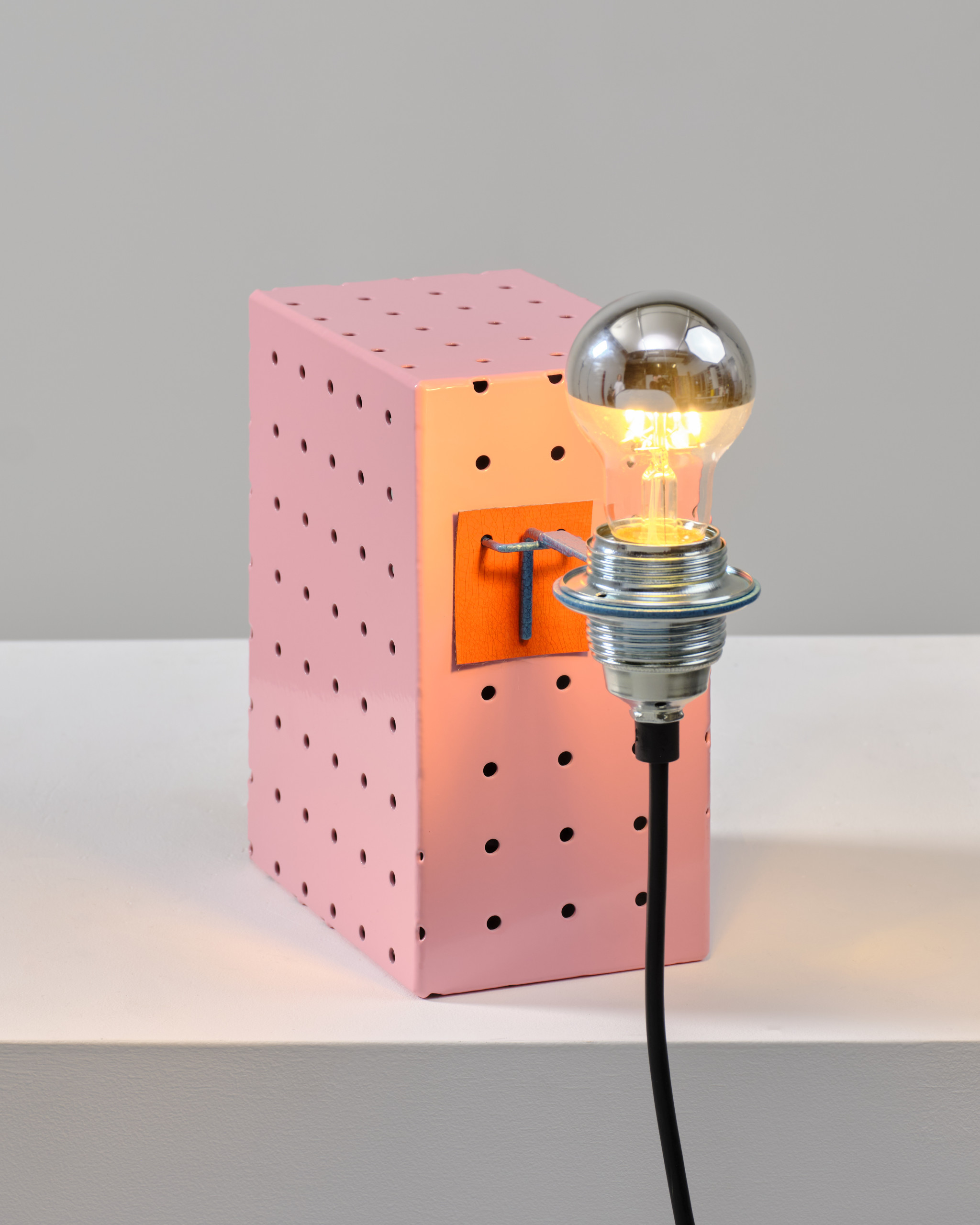 Pink pegboard table lamp
