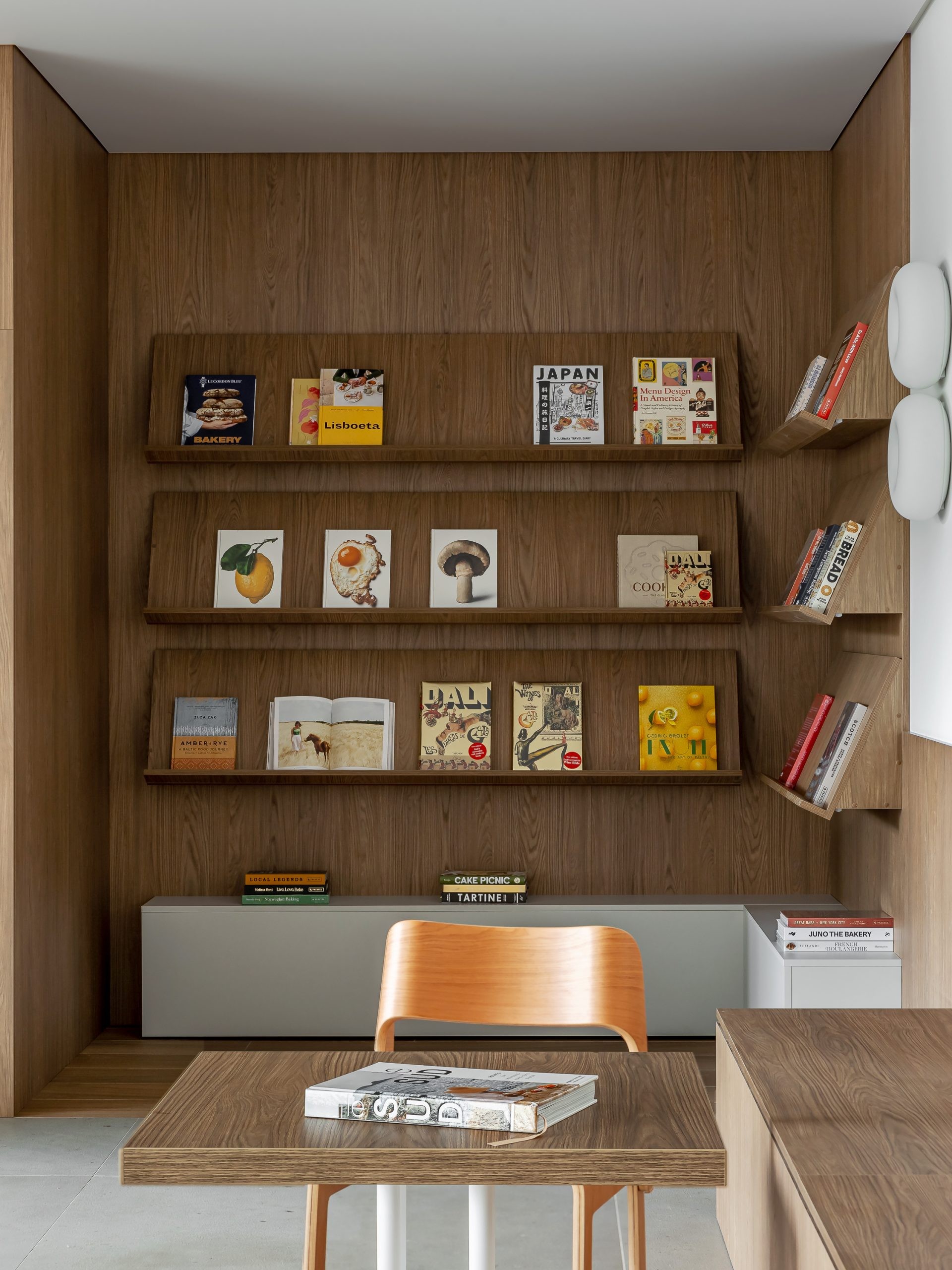 Seating is distributed between individual tables, benches and more communal arrangements.
