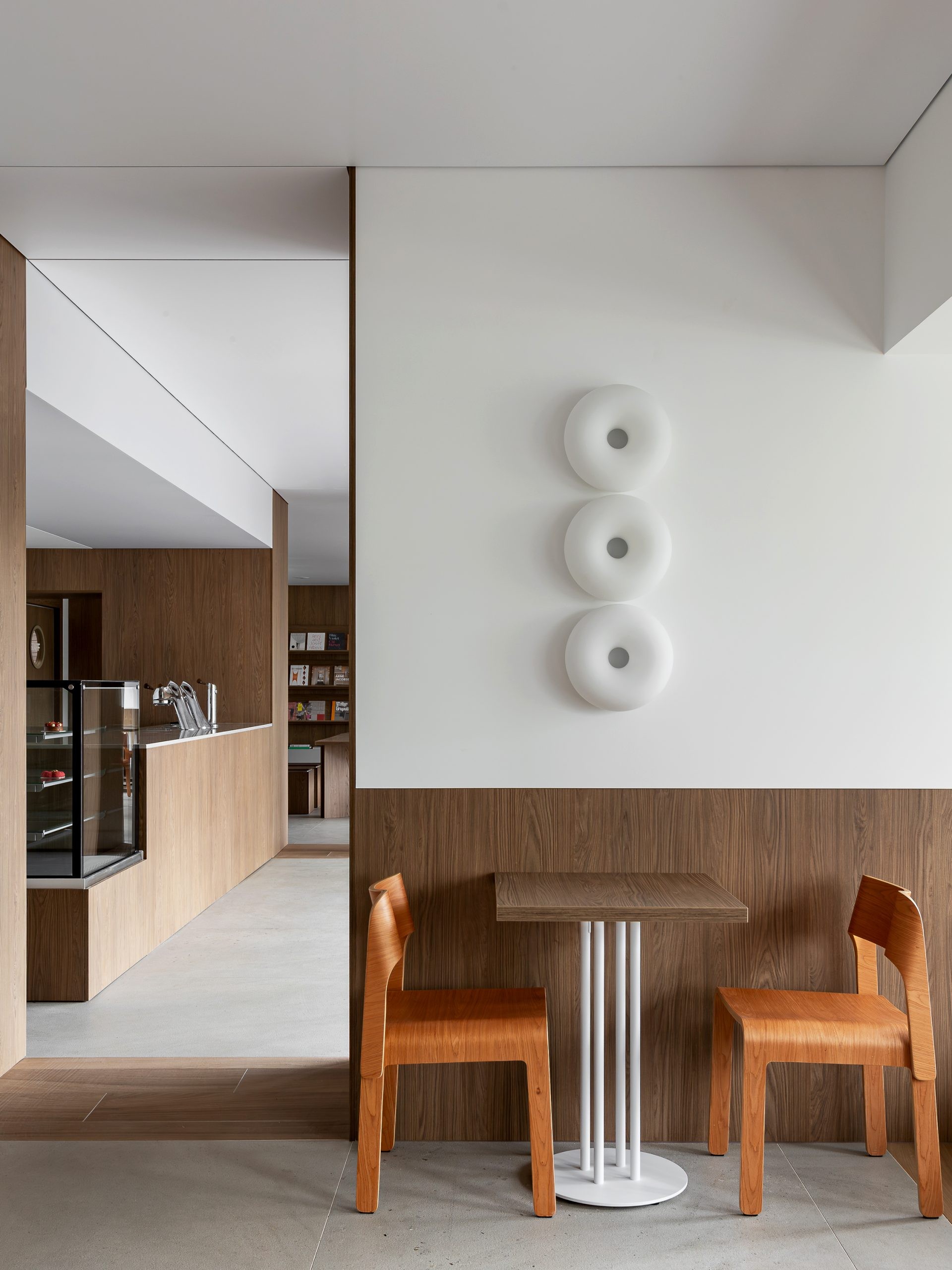 Books, seating and hospitality functions share a continuous interior.