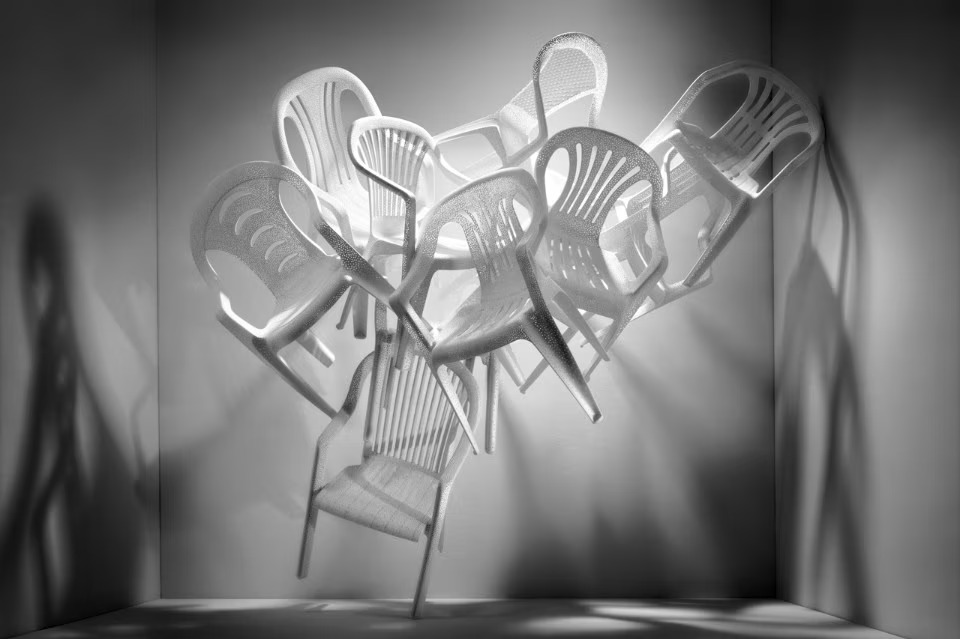 Monobloc chairs gathered into a single sculptural form