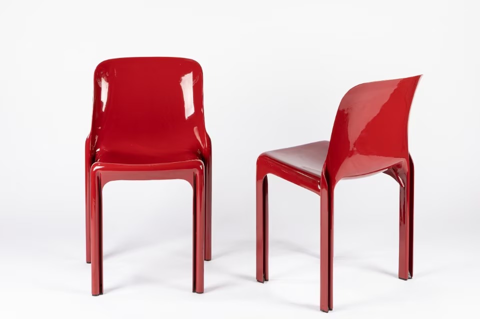Two red Selene chairs by Vico Magistretti