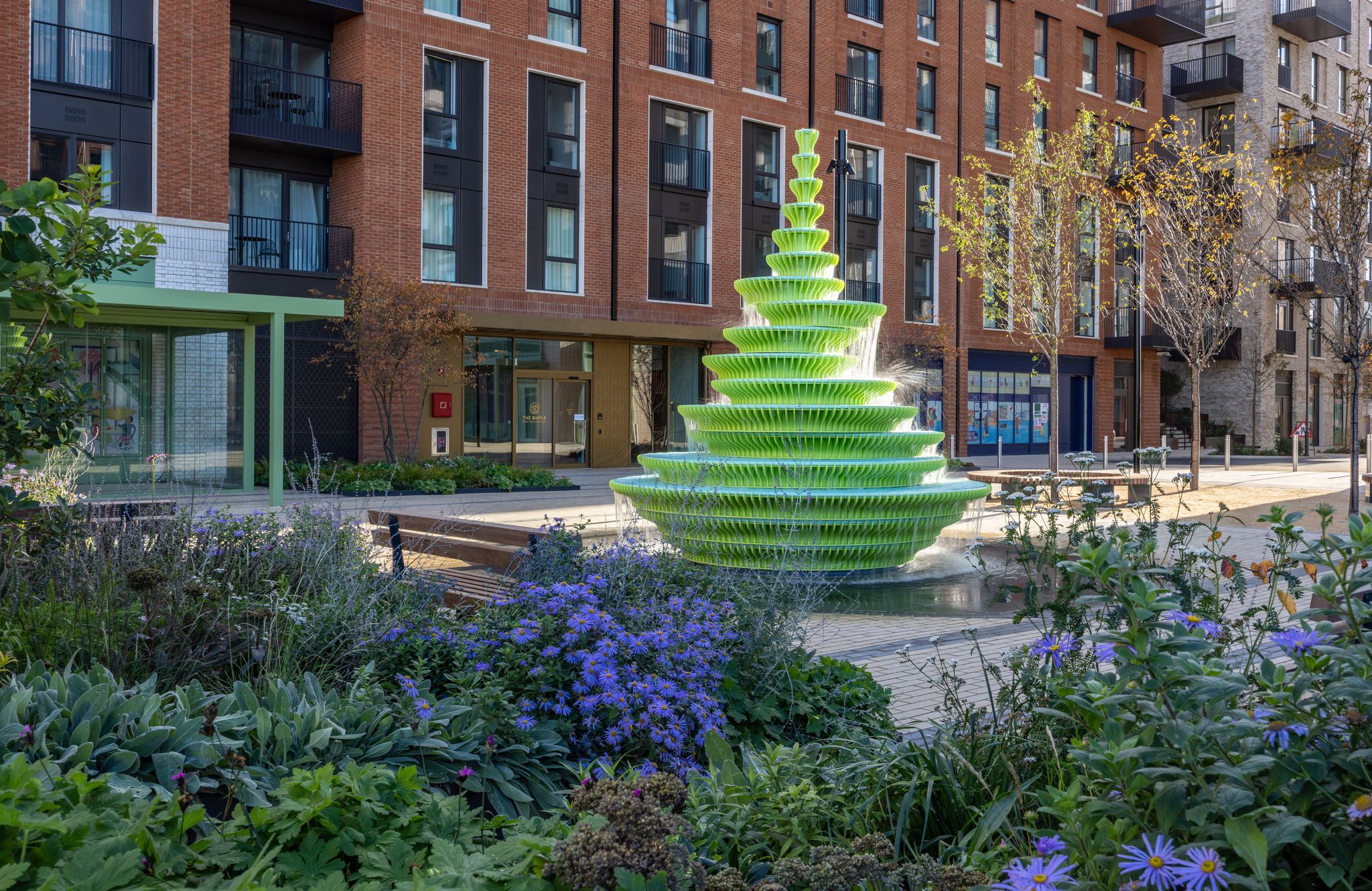 The Fountain among planting and new housing