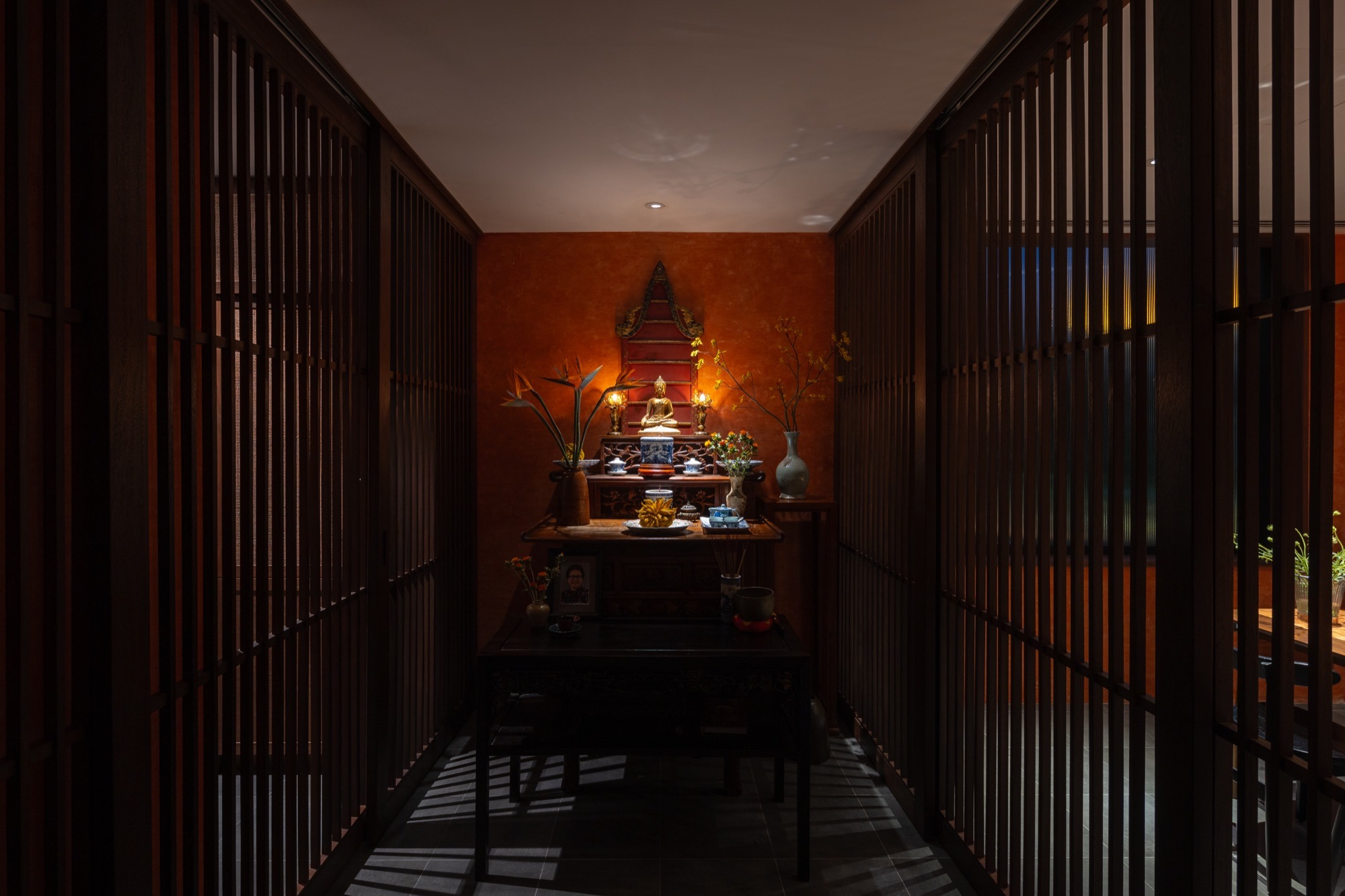 The altar room seen through timber louvres